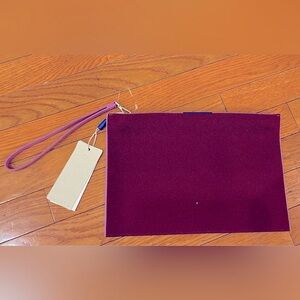 NWT Rothy’s wristlet in Collegiate Currant